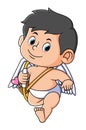 The cupid boy is walking and bringing the arrow and bow Royalty Free Stock Photo