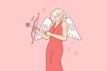 Cupid woman dressed up with wings for valentine day, uses with arrow and bow to seduce boyfriend Royalty Free Stock Photo