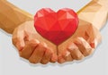 Cupped hands keep red heart low-poly polygon on a gray