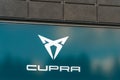 Cupra logo on the window of a car dealer in Lahti, Finland