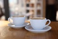 Cups of aromatic coffee on wooden table in cafe, closeup Royalty Free Stock Photo