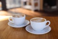 Cups of aromatic coffee on wooden table in cafe, closeup Royalty Free Stock Photo