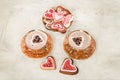 Cups of cappuccino and ginger biscuits in the form of hearts