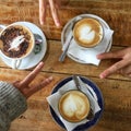 Cups of cappuccino and v signs Royalty Free Stock Photo