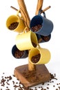 Cups of coffee filled with coffee beans on a stand