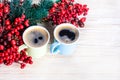 Cups of fragrant coffee on a Christmas background