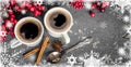 Cups of fragrant coffee on a Christmas background