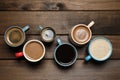 Cups of fresh aromatic coffee on wooden table, flat lay Royalty Free Stock Photo