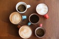 Cups of fresh aromatic coffee on wooden table Royalty Free Stock Photo