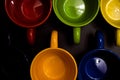 Cups, mugs in different colors are in every kitchen
