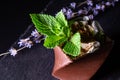 Cups printed on a 3D printer with chocolate, whipped cream and mint leaves