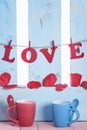Cups with spoons and the word love Royalty Free Stock Photo