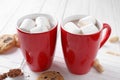 Cups of tasty cocoa with marshmallows and cookies on wooden table Royalty Free Stock Photo