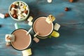 Cups of tasty cocoa and marshmallows on wooden table Royalty Free Stock Photo