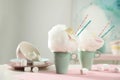 Cups of tasty cotton candy dessert and marshmallow, space for text