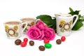 Cups of tea, candies and roses