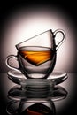 Cups with tea on gray blurred background Royalty Free Stock Photo