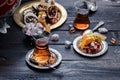 Cups of Turkish tea with oriental sweets on rustic wood Royalty Free Stock Photo