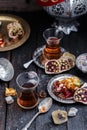 Cups of Turkish tea with oriental sweets on rustic wood Royalty Free Stock Photo