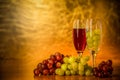 Cups of wine with grapes on a table Royalty Free Stock Photo