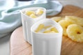 Cups of yogurt with pineapple slices. Multi cooker recipe