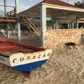 Curacao boat laying on the sandy beach