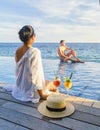 Curacao, couple man and woman mid age relaxing by the swimming pool during vacation in the Caribbean Royalty Free Stock Photo