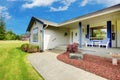 Curb appeal of beige house with blue trim. Royalty Free Stock Photo