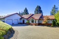 Curb appeal of blue house with brick trim Royalty Free Stock Photo