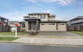 Curb appeal of brand-new home in brown and beige colors Royalty Free Stock Photo