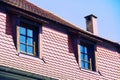 Curb roof with 2 windows and a fireplace Royalty Free Stock Photo