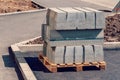 Curb stone on construction site. Pallet With A Stack Of Concrete Curbstone. Road repairs. Royalty Free Stock Photo