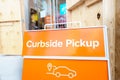 Curbside pickup sign in front of store during the covid 19 pandemic lockdown in New York City