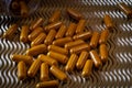 Curcumine capsules on wavy graphic background