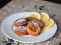 The curd biscuits and a few slices of lemon in white plate