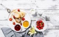 Curd Cheese Pancakes with fresh strawberries and jam. Cottage Cheese Pancakes on a white plate sprinkled with powdered sugar Royalty Free Stock Photo