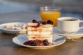 Curd cheese with red cherry jam, orange juice and cup coffee on table. Breakfast concept Royalty Free Stock Photo