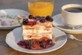 Curd cheese with red cherry jam, orange juice and cup coffee on table. Breakfast concept Royalty Free Stock Photo