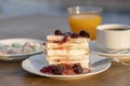 Curd cheese with red cherry jam, orange juice and cup coffee on table. Breakfast concept Royalty Free Stock Photo