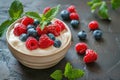 Curd dessert with cream, raspberries, and blueberries garnished with fresh mint Royalty Free Stock Photo