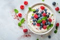 Curd dessert with cream, raspberries, and blueberries garnished with fresh mint Royalty Free Stock Photo