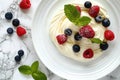 Curd dessert with cream, raspberries, and blueberries garnished with fresh mint Royalty Free Stock Photo