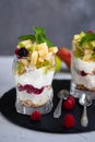 Curd dessert. Made from apples, pears, cookies, decorated with mint and blackberry.