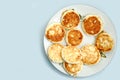 Curd pancake on a white plate. blue table background Royalty Free Stock Photo