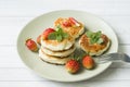 Curd pancakes with strawberries and mint on a plate Royalty Free Stock Photo
