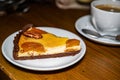 Curd pie with apricots and a Cup of black coffee for breakfast. Selective focus Royalty Free Stock Photo