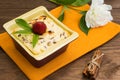 Curd pudding with raisins and strawberry. Wooden rustic table. Close-up