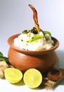 Curd rice in a clay pot with buttermilk chilly