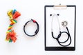 Cure tools for pet cat and dog with toys, stethoscope for treatment in grooming set on white background top view