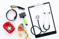 Cure tools for pet cat and dog with toys, stethoscope for treatment in grooming set on white background top view